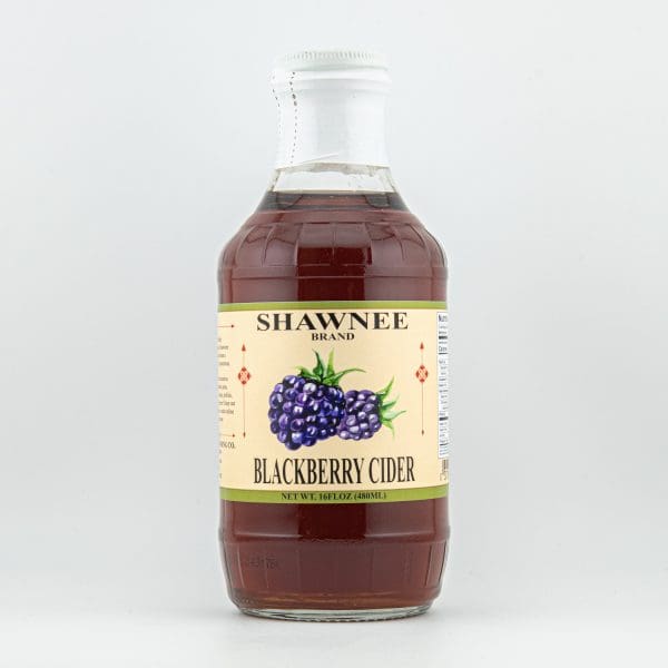 A bottle of Shawnee brand blackberry cider with a beige label and blackberry illustration on a plain white background.